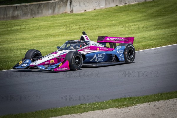 HELIO CASTRONEVES (66) of Sao Paulo, Brazil practices for the XPEL Grand Prix at Road America in