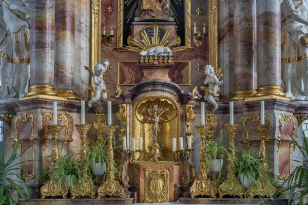 Main altar with candles and tabernacle, St George and Florian is a listed Catholic parish church in
