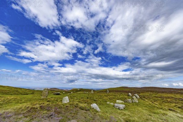 Druids Circle, stone circle in wide landscape with pastures in the mountains, Penmaenmawr,