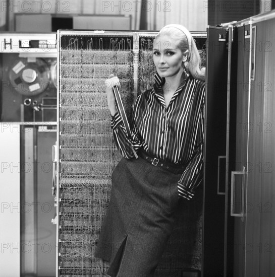 In the 1960s. Fashion model wearing the typical clothes of 1965. The photograph is taken in a 1960s