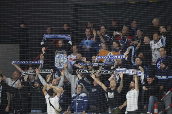 The travelling Ingolstadt fans celebrate the 6:3 victory in Schwenningen after the game of the DEL