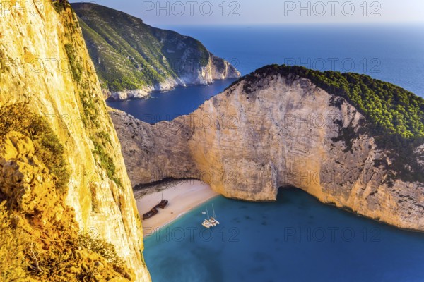 Famous Shipwreck Beach. Romantic fabulous sunset. The picturesque coast of the Greek island of
