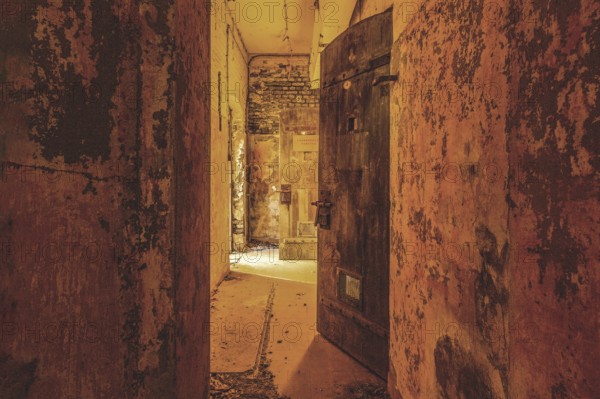Dilapidated corridor with open doors and rusty walls, gloomy and mysterious, Prison H11, Lost