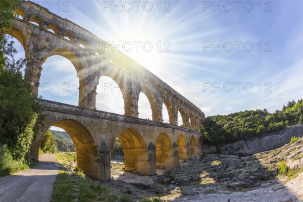 The bridge was built in Roman times on the river Gardon. Three-tiered aqueduct Pont du Gard - the