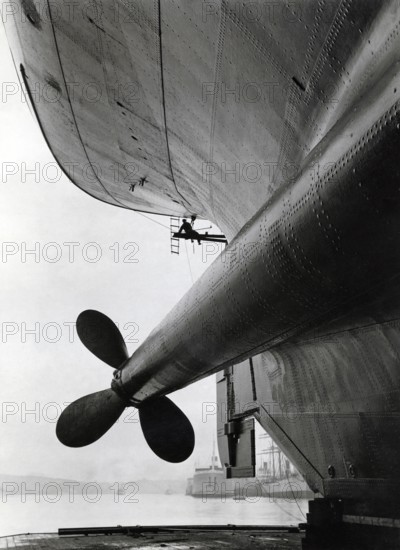 Dockyard in the 1930s. The ship M/S Gripsholm is undergoing maintance and the ship is risen in a