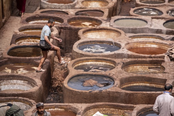 FES, MOROCCO, ARIL 10, 2023, Famous tannery in the medina of Fes, where leather is being processed