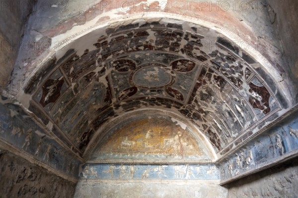 POMPEII, ITALY, MAY 04, 2022, Beautiful colorful stucco in a room niche of a Pompeian villa,