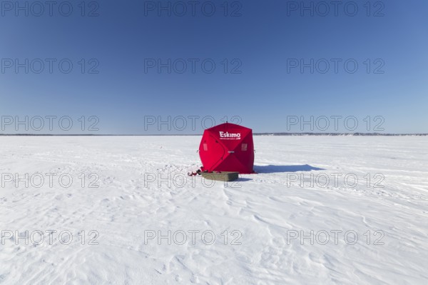 Winter, icefishing tent on the frozen Saint Lawrence River, Province of Quebec, Canada, North