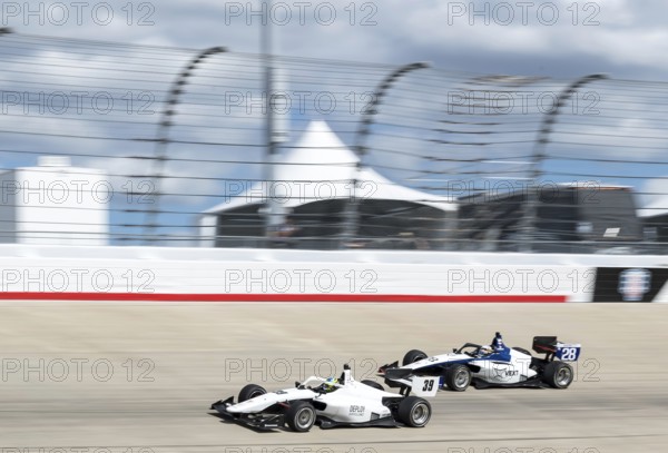 INDY NXT by Firestone Series driver, CHRISTIAN BROOKS (39) (R) of Santa Clarita, California races