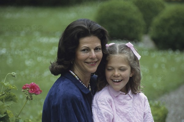 Queen Silvia of Sweden with her daughter crown princess Victoria on the grounds of Solliden castle