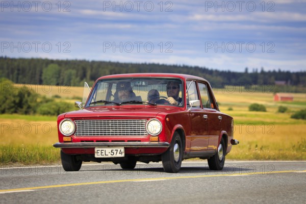 Driving red Lada 1200 on Maisemaruise 2019 car cruise. Lada 1200 was manufactured by the Russian