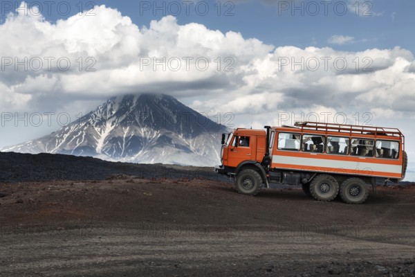 KAMCHATKA, RUSSIA, JUNE 24, 2016: Russian expedition truck KamAZ (6-wheel drive) on mountain road