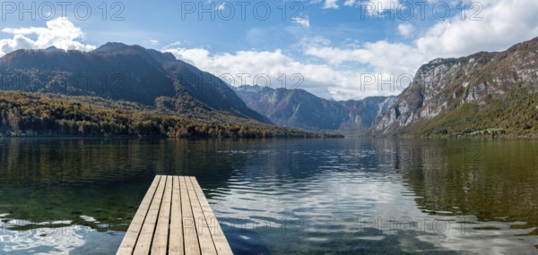 Scenic view of a small wooden jetty at lake Bohinj in the Triglav National Park, The Julian Alps,
