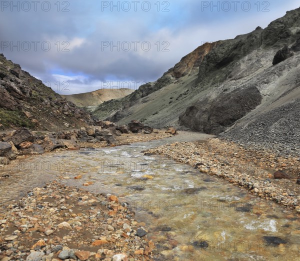 National Park Landmannalaugar in Iceland. Creek in the gorge between the mountains of black