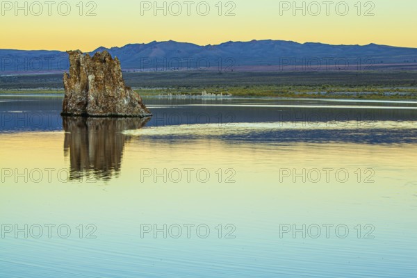 Magic reflections of tuff outliers in lake water. Lime-tuff towers of bizarre shapes rise from the