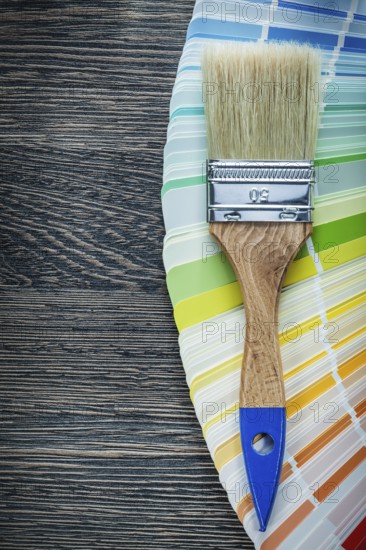 Paintbrushes color pantone fan on wooden board