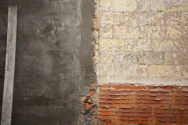 Brickwall construction and mortar cement plaster with rulers