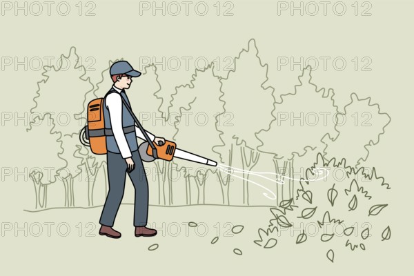 Male gardener in uniform collection leaves with handy vacuum. Man handyman working outdoors in