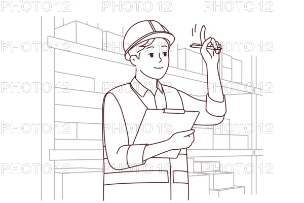Man in uniform and helmet working in warehouse. Smiling male engineer or mechanic at storehouse or