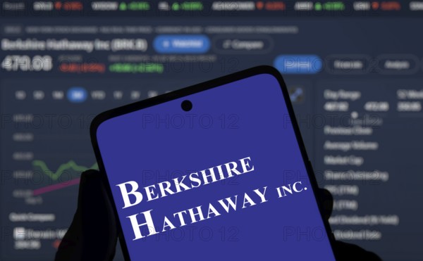 Berkshire Hathaway inc logo is displayed on smartphone. Berkshire Hathaway Inc is an American