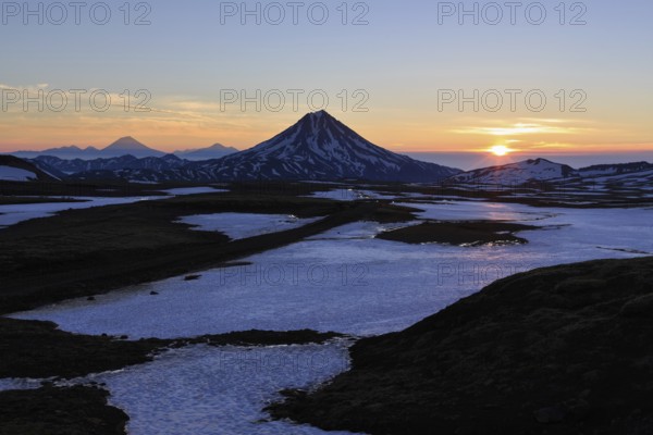 Volcanic landscape of Kamchatka Peninsula: beautiful sunrise over Viluchinsky Volcano. Asia,