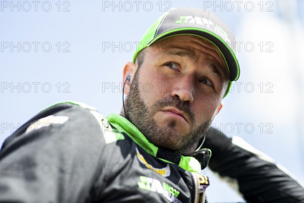 AGUSTIN HUGO CANAPINO (R) (78) of Arrecifes, Argentina suits up on pit road prior to practice for