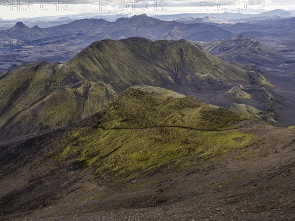 View from Mount Sveinstindur, volcanic landscape, moss-covered hills, mountains, Icelandic