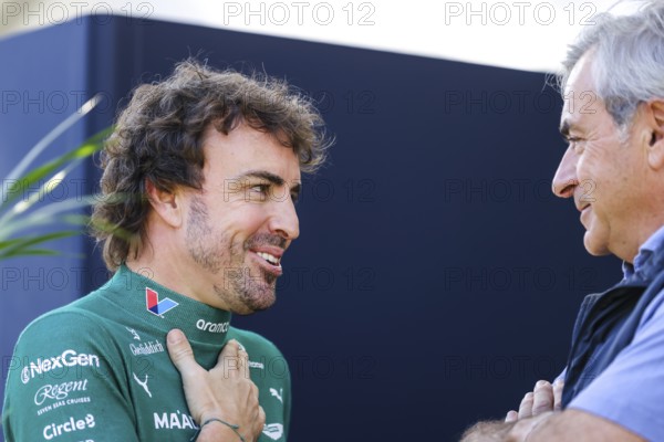 MELBOURNE, AUSTRALIA - MARCH 13: Fernando Alonso of Spain and Aston Martin Aramco F1 Team talks to