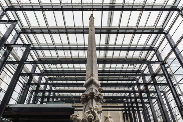 Ljubljana, Slovenia, 04 07 2018: Fountain, column and glass and steel construction at the National