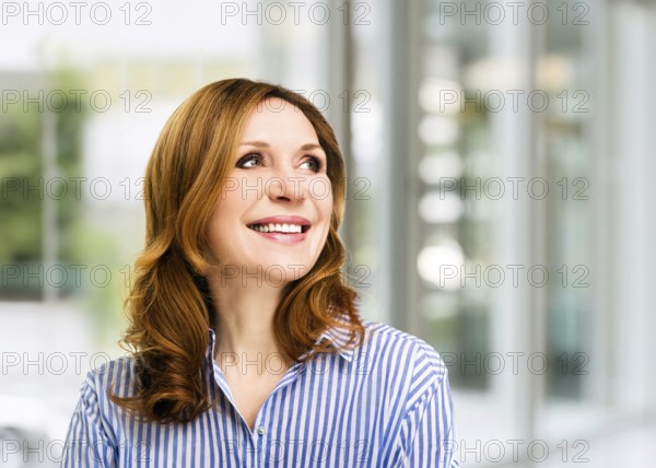 Smiling confident stylish mature middle aged woman at office. Senior businesswoman, executive