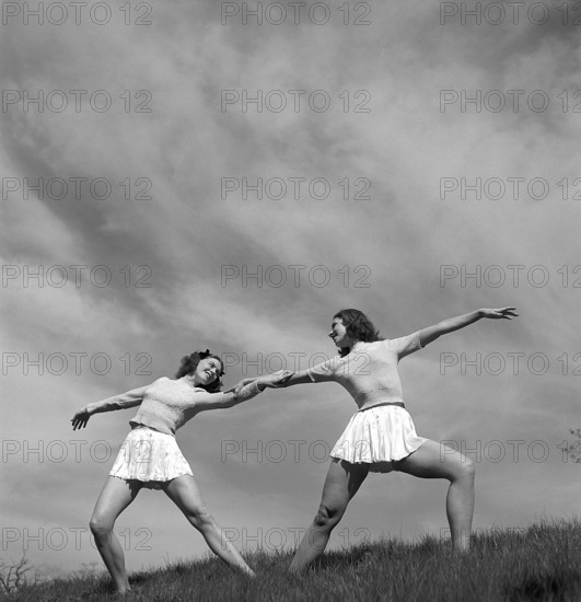 Gymnasts in the 1940s. Lalla Cassels dance troup. Two of the girls are training and poses in a