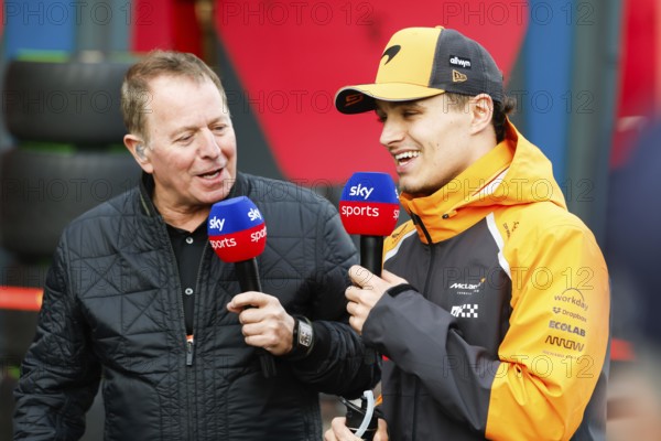 Lando Norris of Great Britain and McLaren Formula 1 Team chats to Martin Brundle after winning the