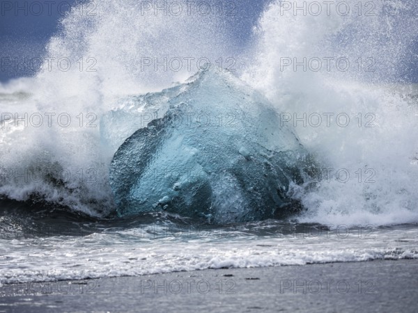 Diamond Beach, iceberg in the surf, near Jökulsarlon glacier lagoon, Vatnajökull National Park,
