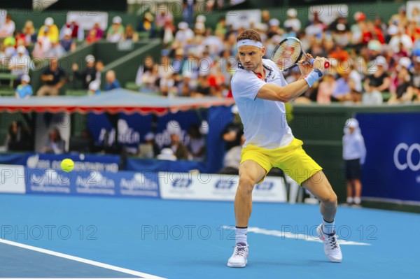 MELBOURNE, AUSTRALIA, JANUARY 16, 2020: Grigor Dimitrov (BUL) hits a backhand to Nick Kyrgios (AUS)