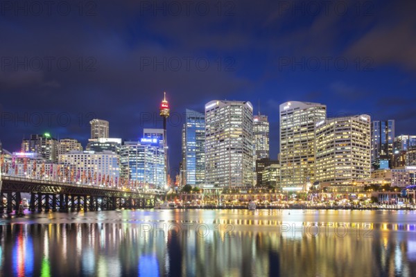 Sydney skyline and Pyrmont bridge at dusk near Darling Harbour, in Sydney Australia