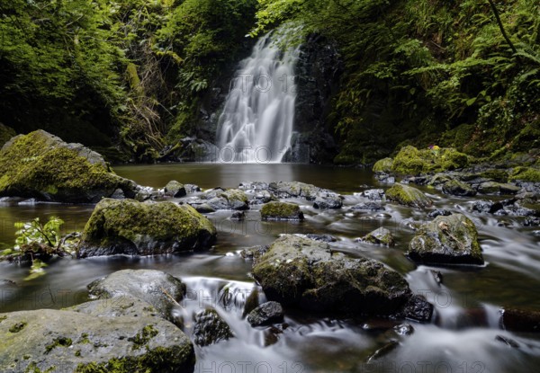 A view of the picturesque Gleno Waterfall in the Glens of Antrim near Larne