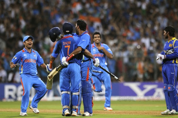 Mahendra Singh Dhoni 2R team mate Yuvraj Singh R Piyush Chawla R Ashwin L celebrate ICC Cricket