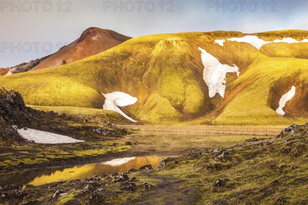 Magic sunrise in the Arctic. The golden light of dawn illuminates the mountains and glaciers