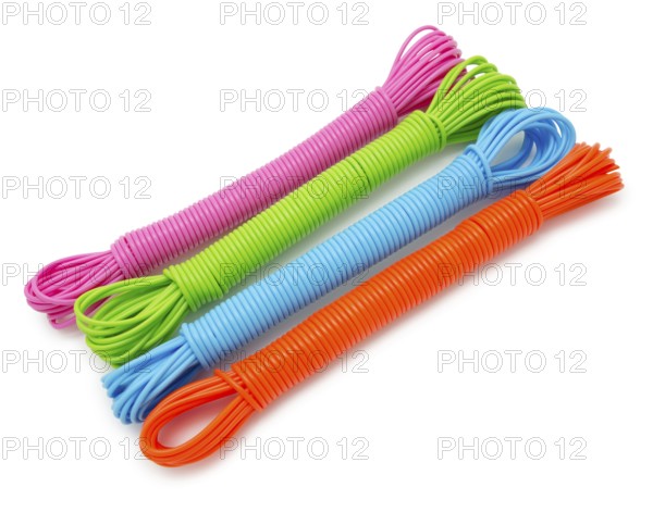 Hanks of colorful plastic linen ropes, over white