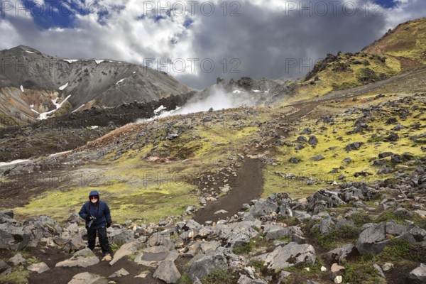 Rhyolite mountains smoldering underground heat. In the hollows lie unmelted snow patches from last