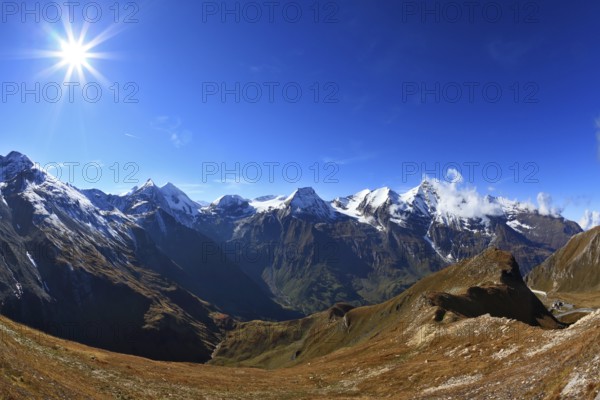 Austrian Alps. Great highway winds between hillsides yellowed. Excursion to the picturesque