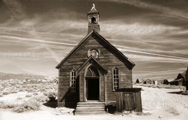This small chapel made of weather-beaten boards stands on the edge of a dusty road in Bodie. Photo