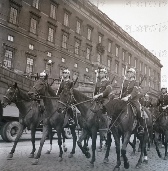 1940s soldiers on horses. In the street with the royal castle in Stockholm in the background,