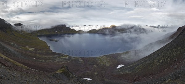 Scenery panorama landscape of Kamchatka Peninsula: view of beautiful mountain lake in crater active