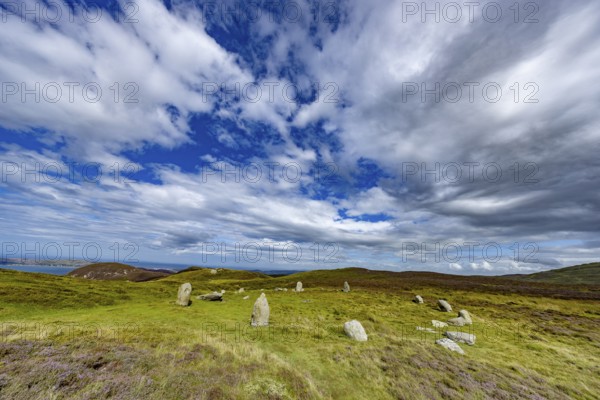 Druids Circle, stone circle in wide landscape with pastures in the mountains, Penmaenmawr,
