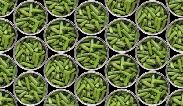 Seamless food background of flat lay view at opened tin cans with green beans isolated on black