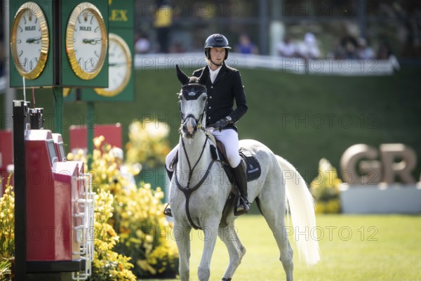 Martin Fuchs of Switzerland and riding Leone Jei compete in the first round of the 1.60m CPKC