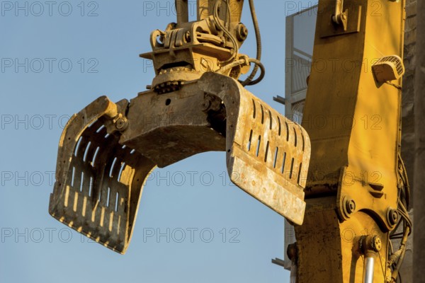 Excavators on a building site demolishing a house, creating space for new flats and living space