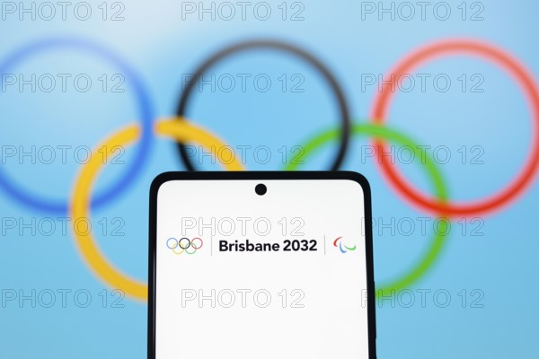 In this photo illustration, the 2032 Summer Olympics Games, Brisbane 2032 logo is displayed on a