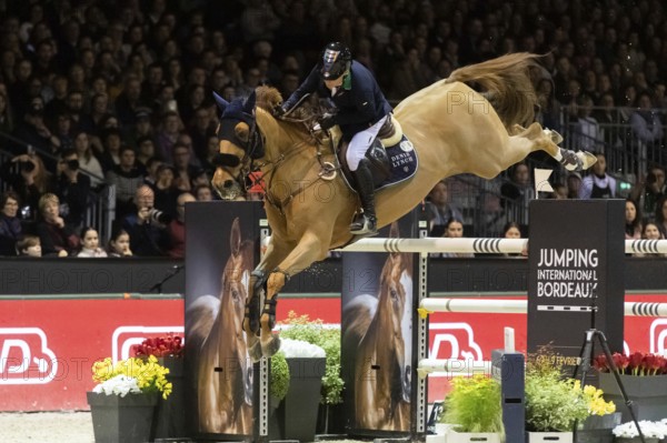 Denis Lynch of Ireland competes in the equestrian Audi Grand Prix at Jumping International
